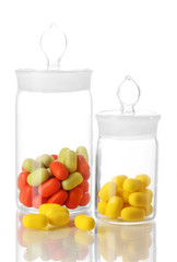 Transparent bottles with pills isolated on white
