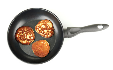 delicious sweet pancakes in frying pan isolated on white