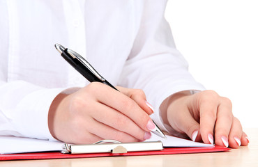 Closeup of businesswoman hands, writing on paper