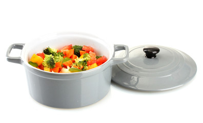 Vegetable stew in gray pot isolated on white