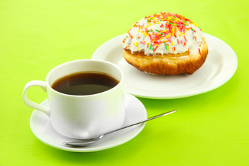 Tasty donuts on color plate on color background