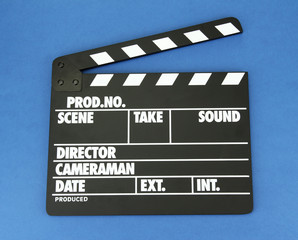 Movie production clapper board on color background