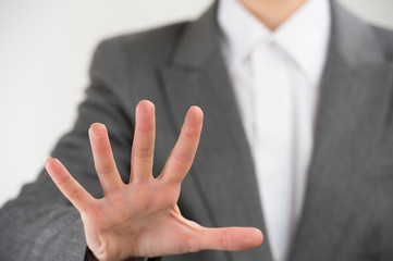 Obraz premium Business woman pointing her fingers on imaginary virtual buttons