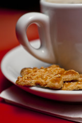Coffee cup with biscuit