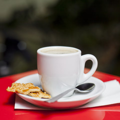 Coffee cup with biscuit
