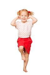 Happy little blond girl dancing and smiling.