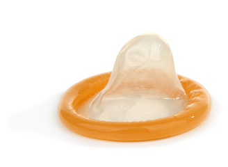 Yellow condom isolated on white