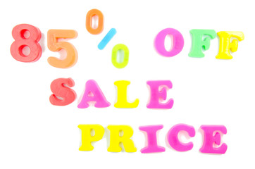 85% written in fridge magnets on white background