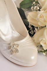 Bridal flowers and bridal shoe - wedding bouquet and shoe