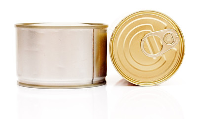 A pile of tinned foods with no labels on white background