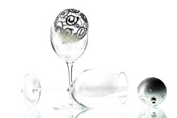 Silver Christmas ball in broken glass
