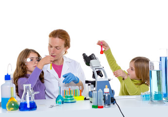 children girlas and teacher woman at school laboratory