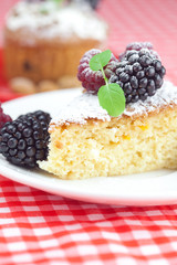 muffin with whipped cream, cake with icing, raspberry, blackberr