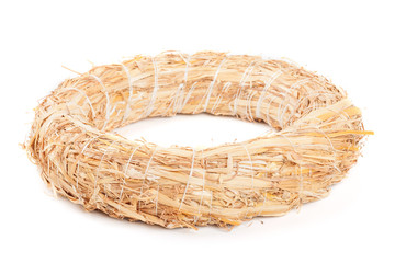 Wreath made with straw isolated on white background