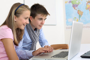 Highschool students working on computer