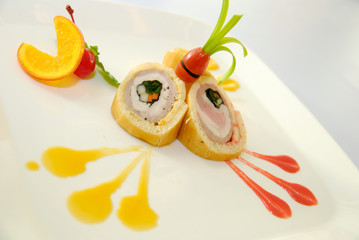Bread roll with ham, cheese, carrot on the plate