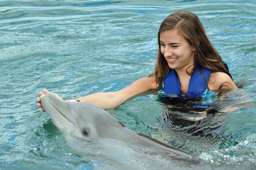 Girl swimming with Dolphin