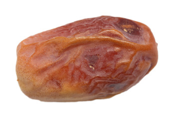Single dried date fruit from low perspective 