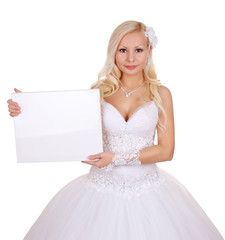 beautiful bride holding the white board with space for text