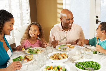 Family Enjoying Meal At Home - obrazy, fototapety, plakaty