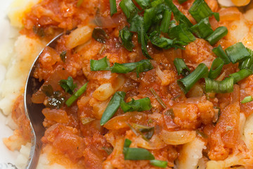 stewed in tomato sauce