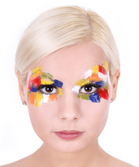 blonde girl with multicolored art makeup isolated