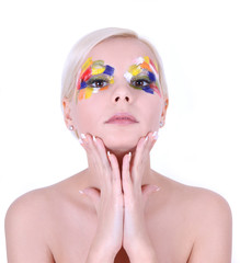 girl with multicolored art makeup and french manicure isolated