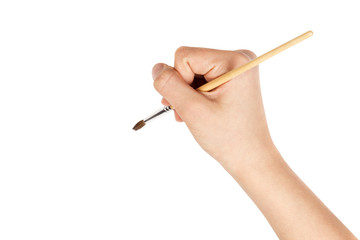female teen hand with a brush