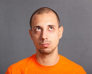 Fototapeta premium Young Man Portrait on Grey Background