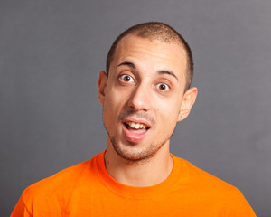 Obraz premium Young Man Portrait on Grey Background