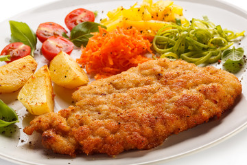 Pork chop, baked potatoes and vegetable salad