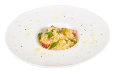 photo of delicious risotto dish with herbs and tomato on white b
