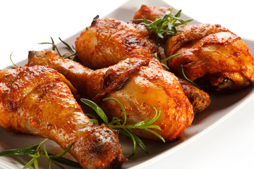 Grilled chicken legs on white background