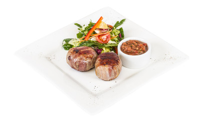 Grilled steak wrapped in bacon, with grilled vegetables, mashed