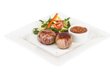 Grilled steak wrapped in bacon, with grilled vegetables, mashed