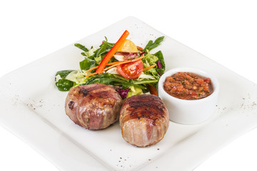 Grilled steak wrapped in bacon, with grilled vegetables, mashed