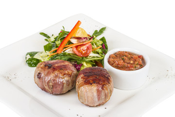 Grilled steak wrapped in bacon, with grilled vegetables, mashed