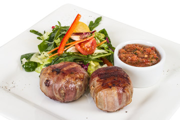 Grilled steak wrapped in bacon, with grilled vegetables, mashed