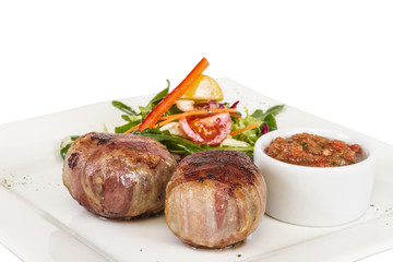 Grilled steak wrapped in bacon, with grilled vegetables, mashed