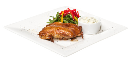 roasted chicken with vegetables on a white plate