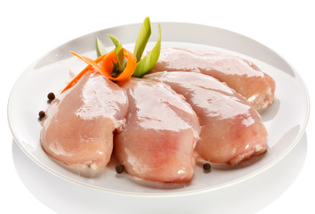 Raw chicken breasts on white background