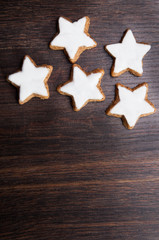 Christmas gingerbread cookies on dark wooden background © Kamila Cyganek