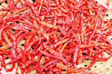 Chili peppers drying in the sun in Thailand.