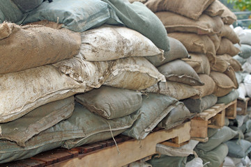 Brown and green sandbags to guard against attacks