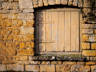 Small Wooden Door In A Stone Wall