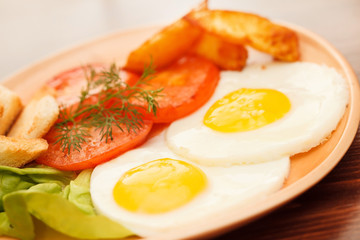 fried eggs with vegetables