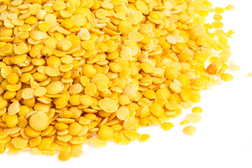 Yellow lentils isolated on white background. Macro shot