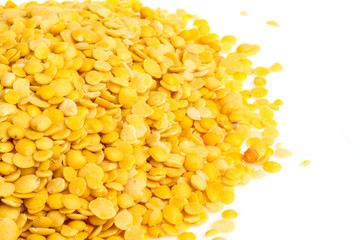 Yellow lentils isolated on white background. Macro shot