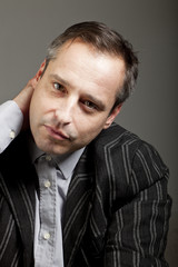 portrait of adult man isolated on dark background