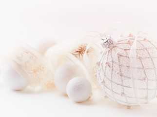 Fototapeta na wymiar White christmas balls with satin ribbon